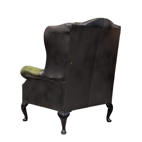 887 - A deep button leather club armchair.  83x80x103cm