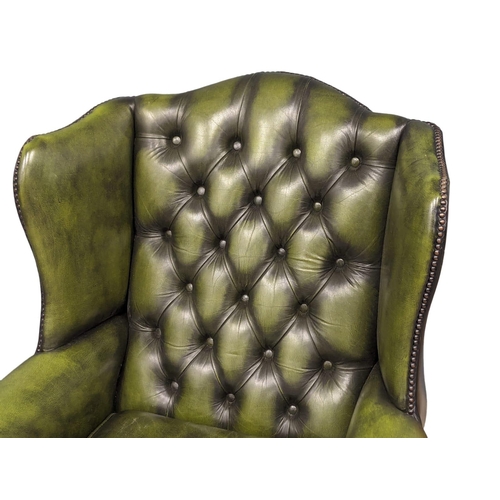 887 - A deep button leather club armchair.  83x80x103cm