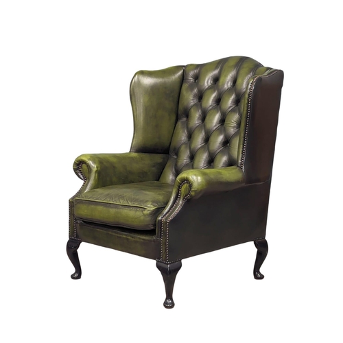 887 - A deep button leather club armchair.  83x80x103cm