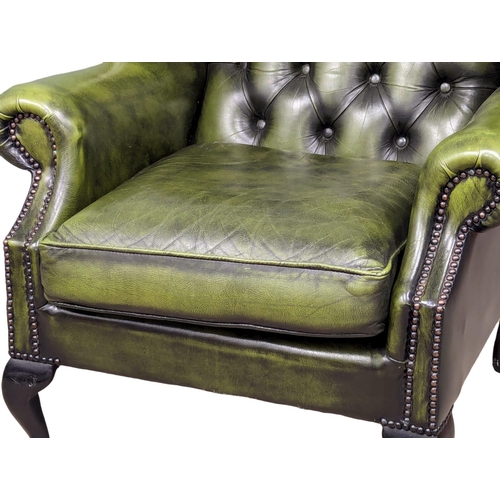 887 - A deep button leather club armchair.  83x80x103cm