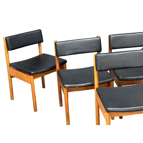 890 - A set of 5 Mid Century dining chairs with black vinyl seats and backs. Stamped crows feet.