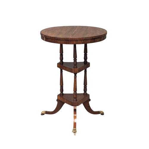 928 - A Regency rosewood lamp table on brass lion paw feet, circa 1810. 50.5x72cm