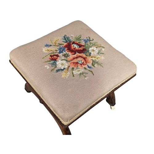 932 - A Victorian mahogany footstool with tapestry top. Circa 1860. 42x36cm