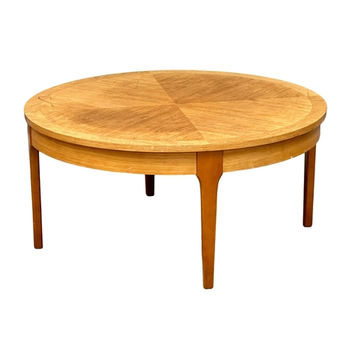 950 - A Mid Century teak coffee table by Stonehill. 87x41cm