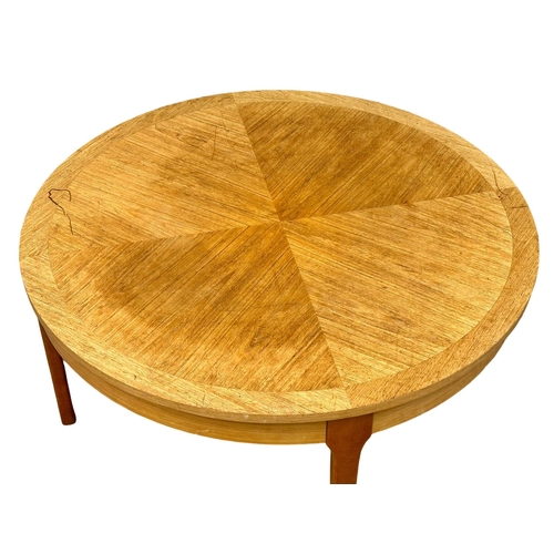 950 - A Mid Century teak coffee table by Stonehill. 87x41cm