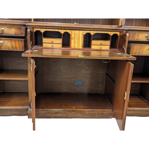 958 - A large Georgian style mahogany secretaire breakfront bookcase with astragal glazed doors and adjust... 