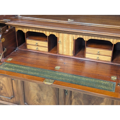 958 - A large Georgian style mahogany secretaire breakfront bookcase with astragal glazed doors and adjust... 