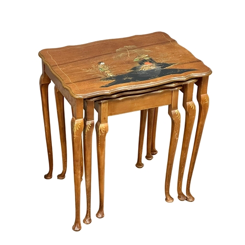 962 - A vintage coffee table and matching nest of tables with Chinoiserie decoration.