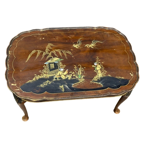 962 - A vintage coffee table and matching nest of tables with Chinoiserie decoration.