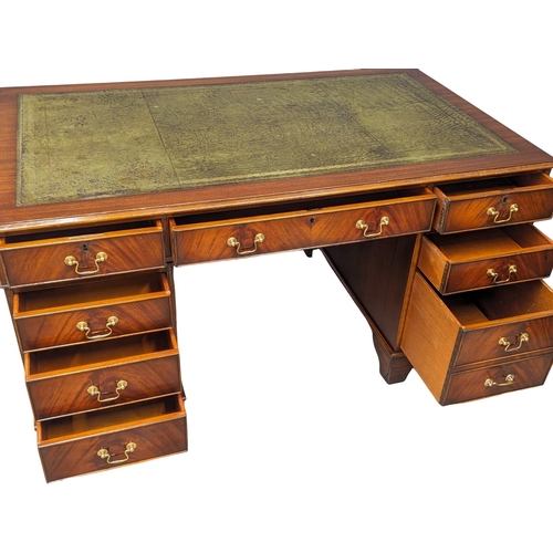 964 - A large Georgian style mahogany pedestal writing desk with leather top. 153x90x79cm