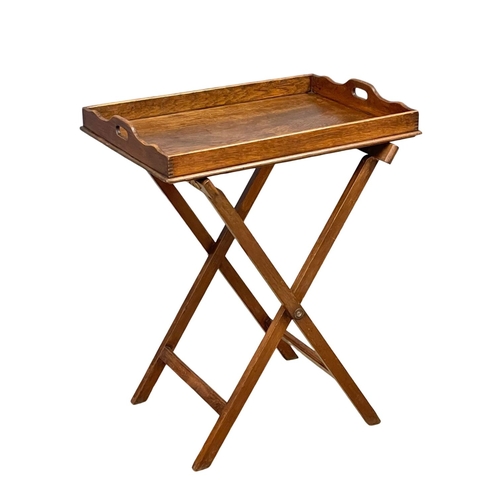 1205 - An Edwardian oak butlers tray on stands 70x51x86cm