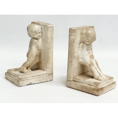 9 - A bust of a young girl attributed to Sophia Rosamund Praeger, and a pair of bookends in the manner o... 