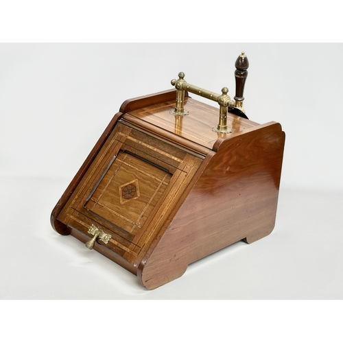 12 - A late Victorian inlaid mahogany coal scuttle in the Aesthetic Movement. 33.5x49x40cm