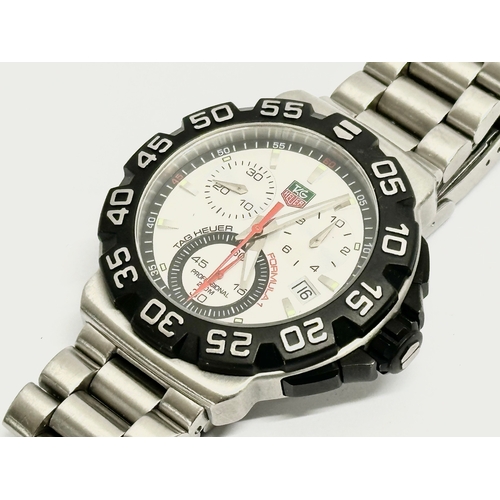 401 - A gents Tag Heuer Formula 1 watch with case. CAH1111 NQ7557.