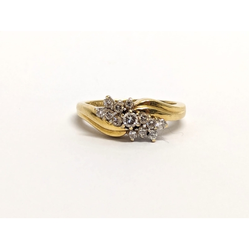 405 - An 18ct gold diamond cluster ring. 4.63 grams. Size L.