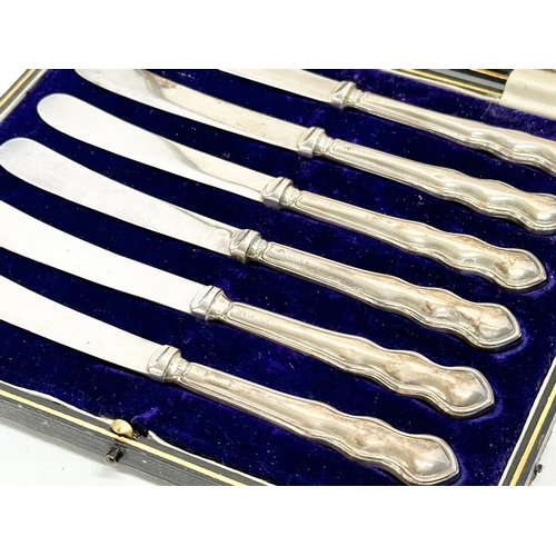 416 - A set of 6 early 20th century silver handled butter knives with case, by John Biggin. 1908.