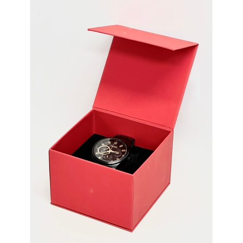 418 - A gents Hugo Boss ‘Skeleton’ watch with box. HU 433.1.34.3568 1.172.201