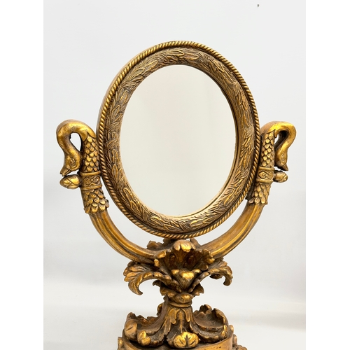 51 - A pair of large gilt framed tabletop mirrors/dressing mirrors. 46x63cm