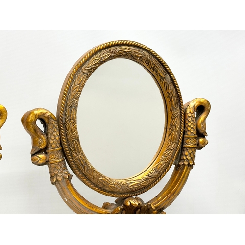 51 - A pair of large gilt framed tabletop mirrors/dressing mirrors. 46x63cm