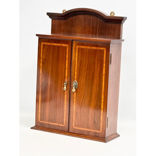53 - An Edwardian inlaid mahogany wall hanging/tabletop gents mirror back vanity cabinet. 33.5x12x48cm