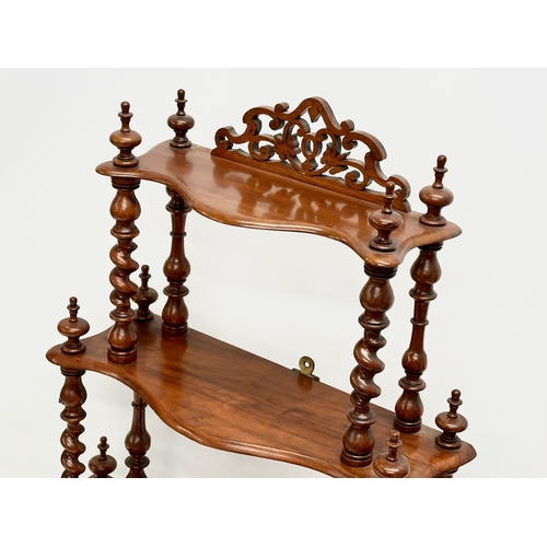 57 - A Victorian walnut 3 tier tabletop/wall hanging whatnot with Barley Twist supports. 56x19x65cm