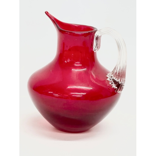 69 - 2 Ruby Glass jugs designed by Geoffrey Baxter for Whitefriars. 17cm