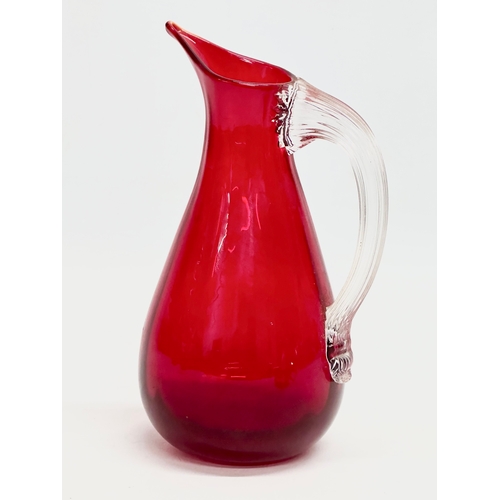 69 - 2 Ruby Glass jugs designed by Geoffrey Baxter for Whitefriars. 17cm