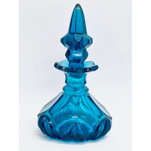71 - A mid 20th century blue cut glass perfume bottle/scent bottle. 16cm