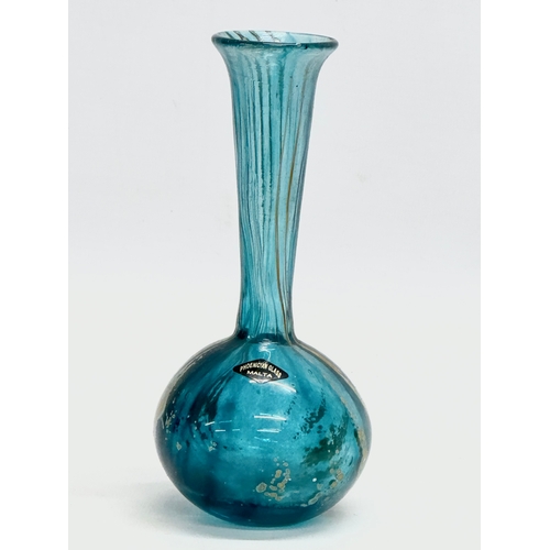 75 - A Phoenician Glass iridescent bottle vase. Malta. 16cm