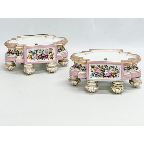 77 - A pair of late 19th century hand painted porcelain stands. 20x13x9cm