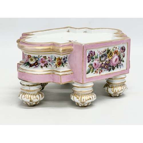 77 - A pair of late 19th century hand painted porcelain stands. 20x13x9cm