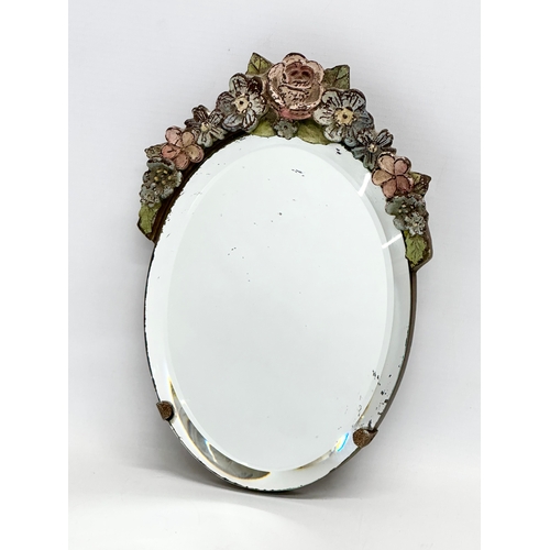 81 - A 1930’s Barbola bevelled mirror. 17x24cm