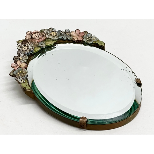 81 - A 1930’s Barbola bevelled mirror. 17x24cm