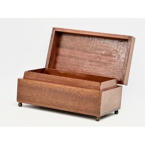 393 - An early 20th century mahogany musical storage box. Working. 19.5x10.5x8.5cm.