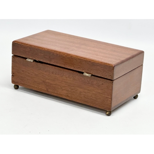 393 - An early 20th century mahogany musical storage box. Working. 19.5x10.5x8.5cm.