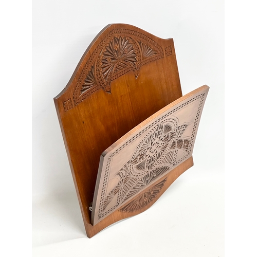 97 - A large late 19th/early 20th century chip carved birch wall hanging paper rack. Circa 1900. 34x44cm
