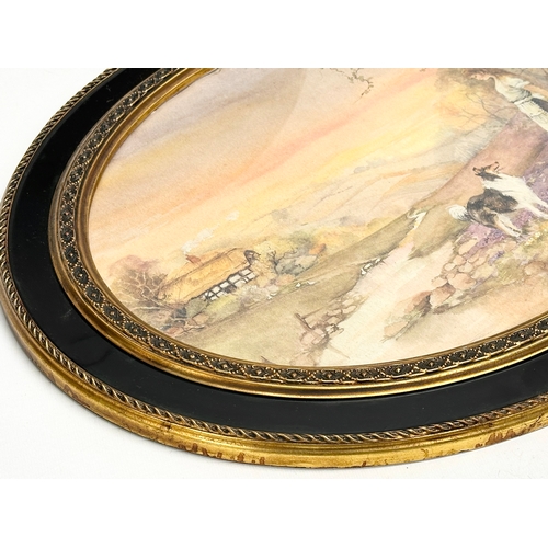 384 - A pair of vintage gilt and lacquered oval framed farm scene prints. 50x40cm