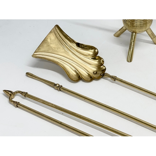 58 - Christopher Dresser. A pair of good quality late 19th century brass fire andirons attributed to Chri... 