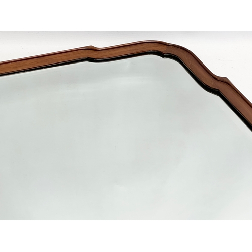 380 - An early 20th century mahogany framed bevelled mirror. Circa 1920. 75x49cm