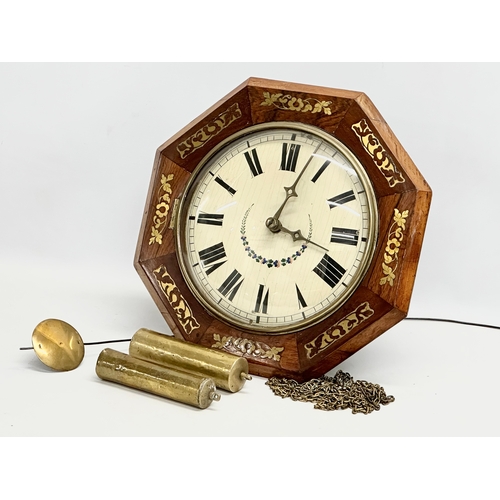 86 - A Victorian rosewood Wag on the Wall clock with brass inlay. Weights and pendulum. Face measures 34c... 