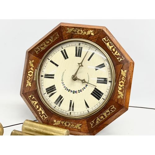 86 - A Victorian rosewood Wag on the Wall clock with brass inlay. Weights and pendulum. Face measures 34c... 