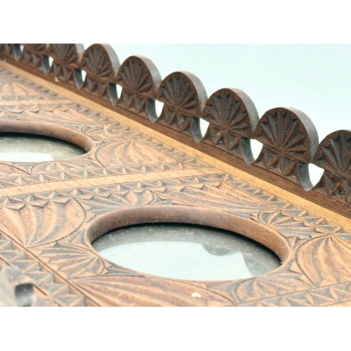 96 - A large late 19th century carved teak wall hanging picture frame. Circa 1880. 71x5x21.5cm