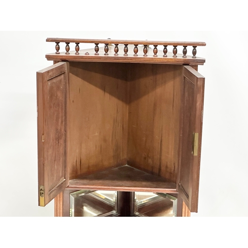 153 - A late Victorian mahogany wall hanging corner cabinet with gilt painted aesthetic movement panels an... 