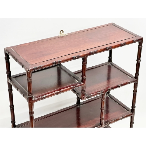 375 - A vintage Chinese rosewood tabletop bogu display stand with bamboo style supports. 48x20x58cm