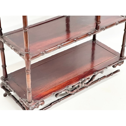 375 - A vintage Chinese rosewood tabletop bogu display stand with bamboo style supports. 48x20x58cm