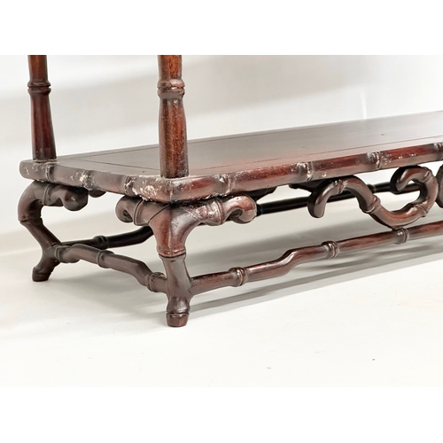 375 - A vintage Chinese rosewood tabletop bogu display stand with bamboo style supports. 48x20x58cm