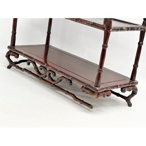 375 - A vintage Chinese rosewood tabletop bogu display stand with bamboo style supports. 48x20x58cm