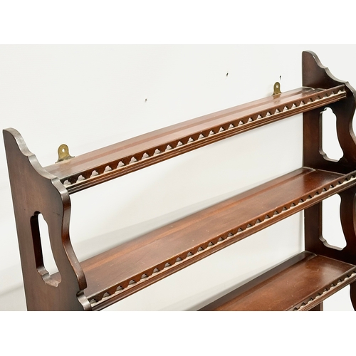 373 - A mahogany 4 tier wall hanging whatnot open bookcase. 75x20x80cm