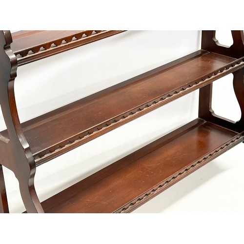 373 - A mahogany 4 tier wall hanging whatnot open bookcase. 75x20x80cm