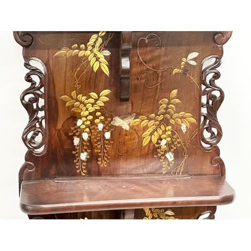 87 - A large late 19th century Japanese late Meiji period carved wall shelf with painted flower motif, fa... 